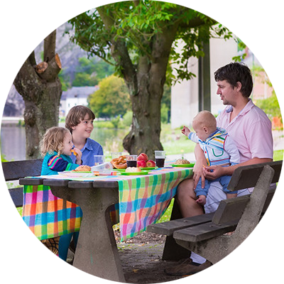 father-with-kids-picnic-bench
