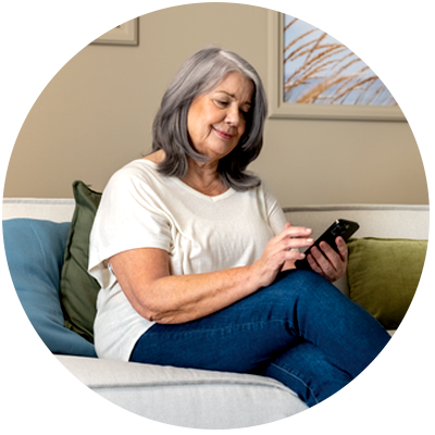 person sitting with mobile in hand